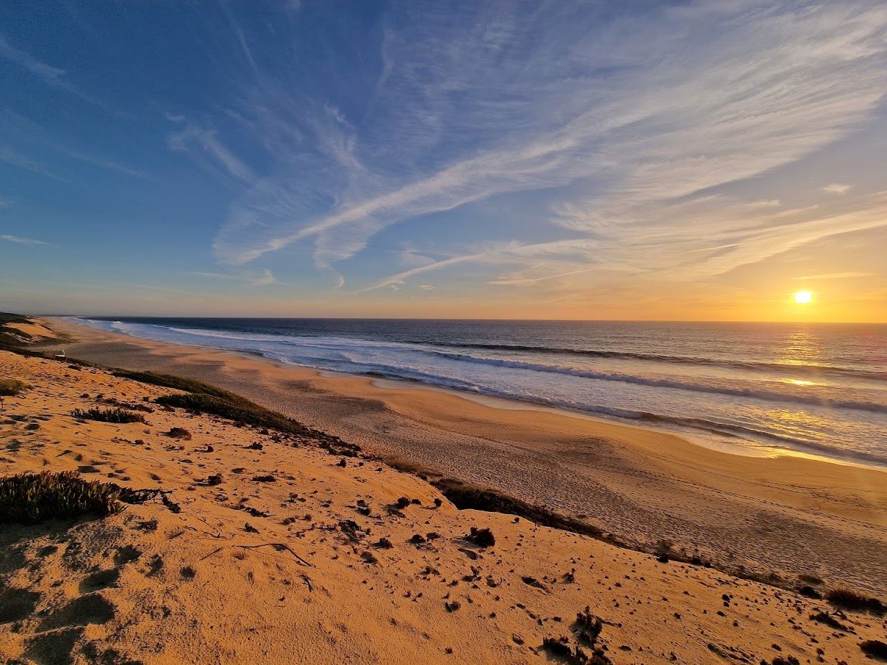 High vegetated dunes above the wild sand of Praia da Aberta Nova