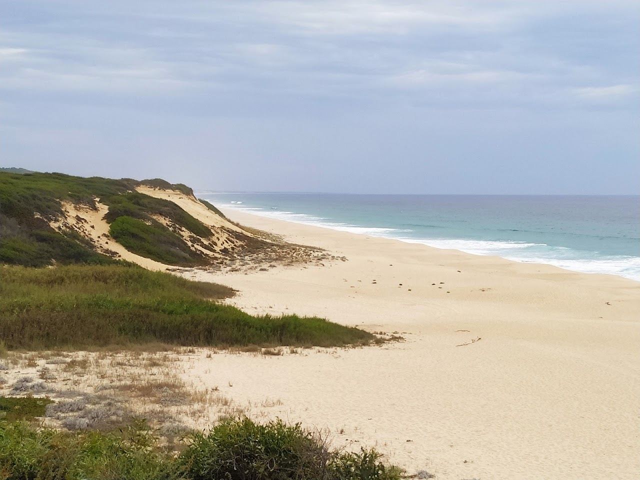 The wide dune backed Atlantic sand of Praia da Aberta Nova near Melides