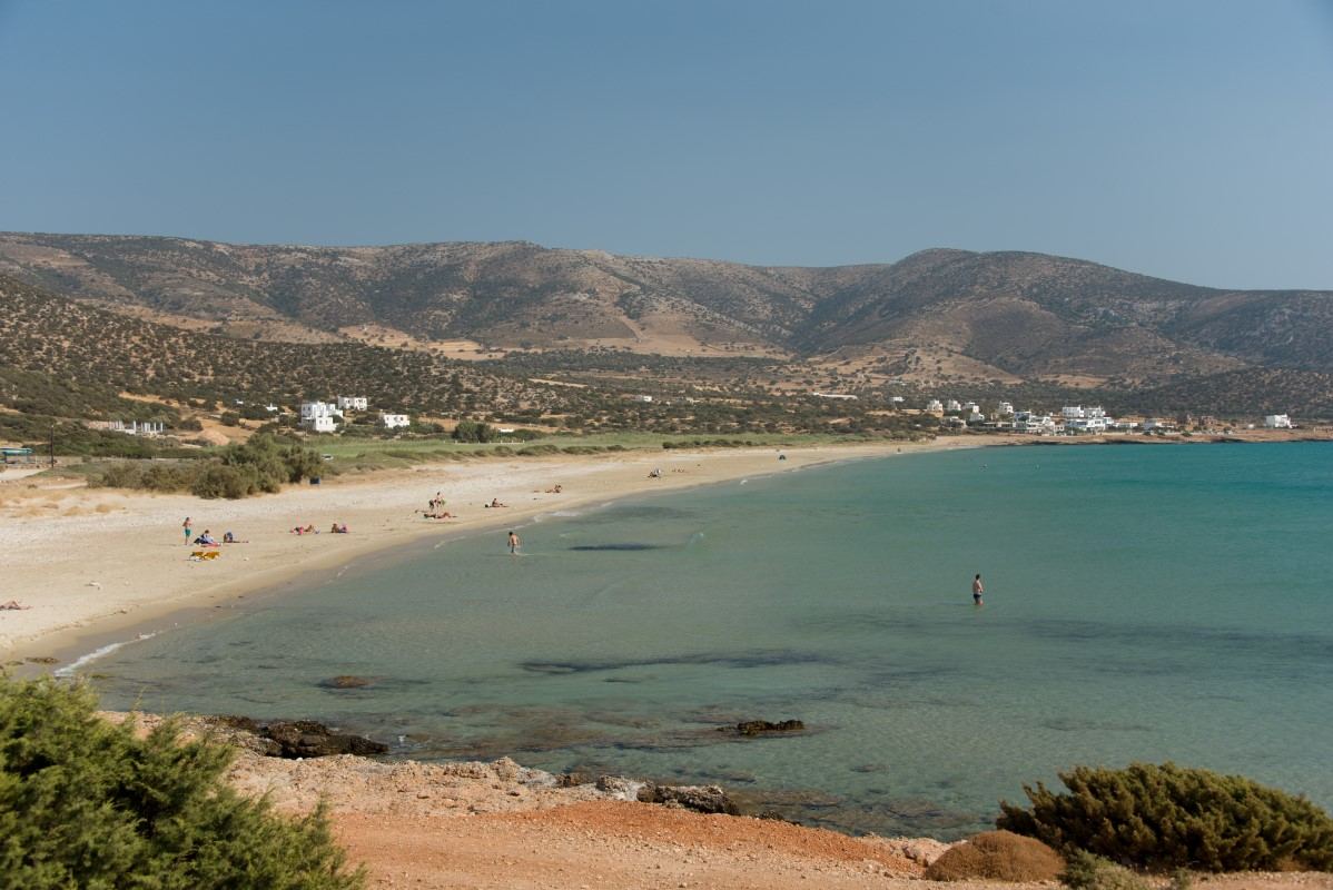 The calm shallow water and fine sand of the sheltered Agiassos bay in the south of Naxos