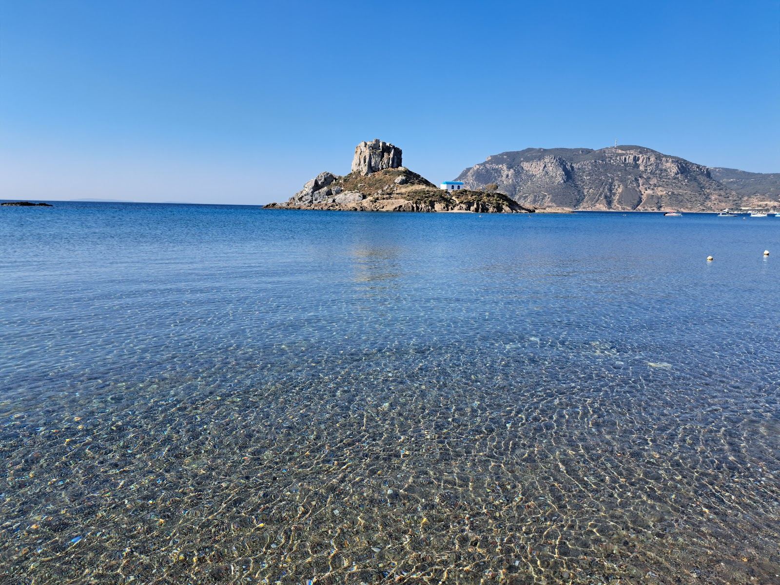 The islet of Kastri and its chapel off the sandy bay of Agios Stefanos in Kos