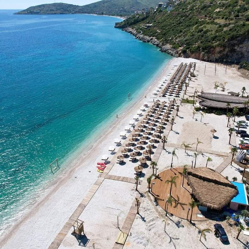 Long free pebble, wild coves and cheap beach bars, far from the Ksamil crowds.