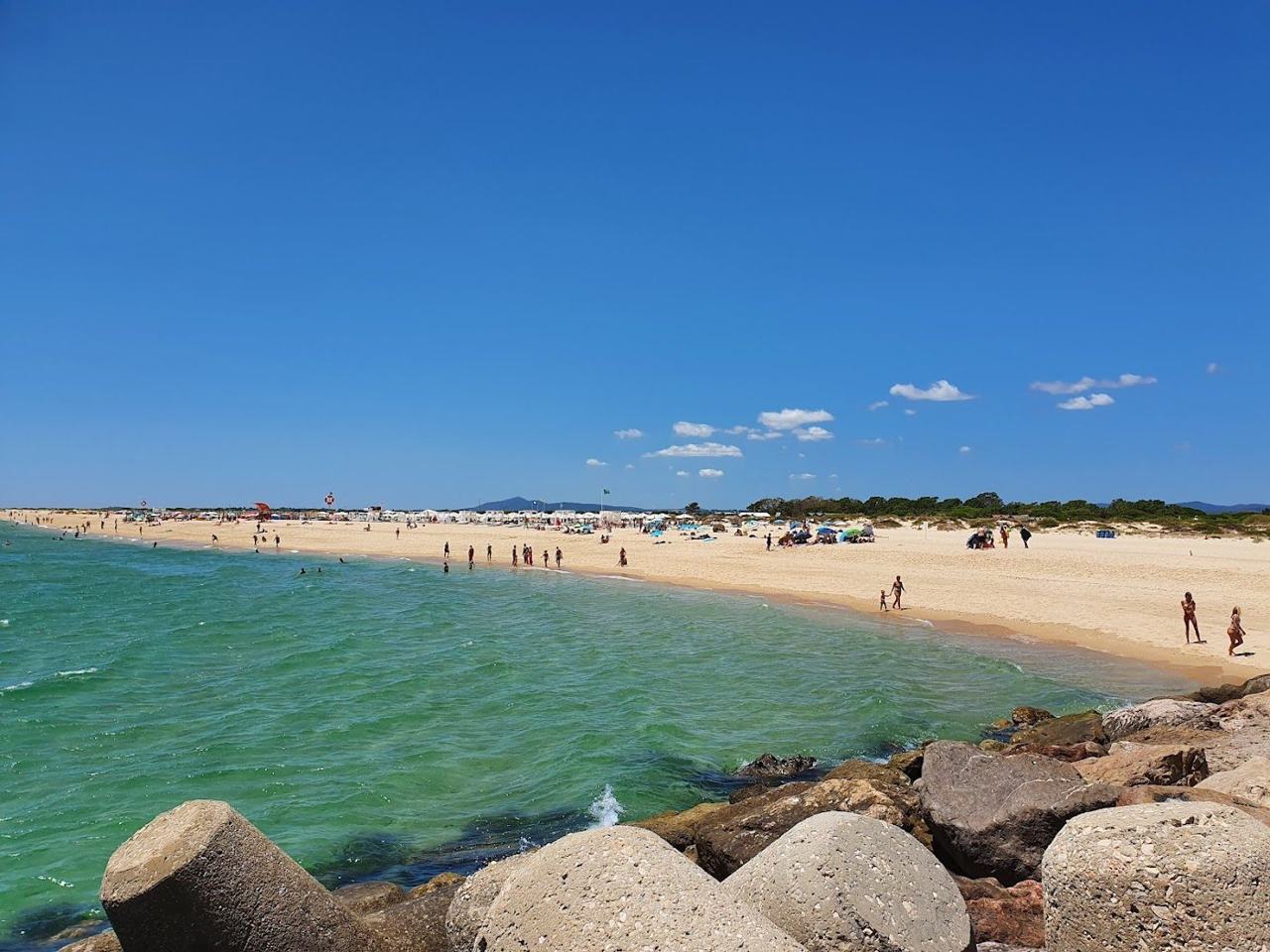 Calm shallow water over pale sand at a sheltered sandbar beach near Tavira in the Algarve