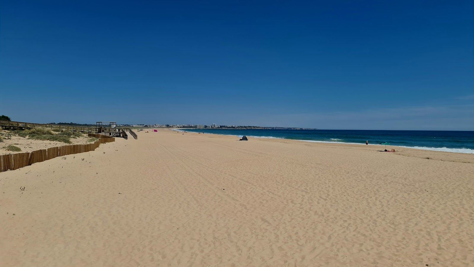 The long golden sweep of Meia Praia beside the town of Lagos in the Algarve