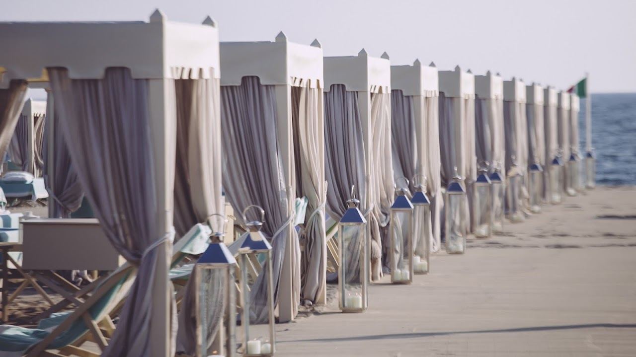 Rows of white cabana tents on the sand at Alpemare beach club in Forte dei Marmi