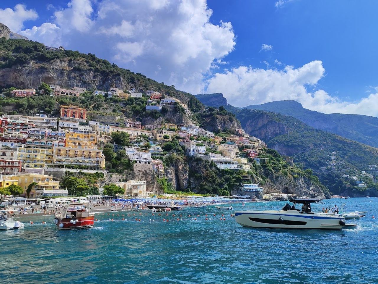 Pastel houses above the pebble beach at Spiaggia Grande in Positano on the Amalfi Coast