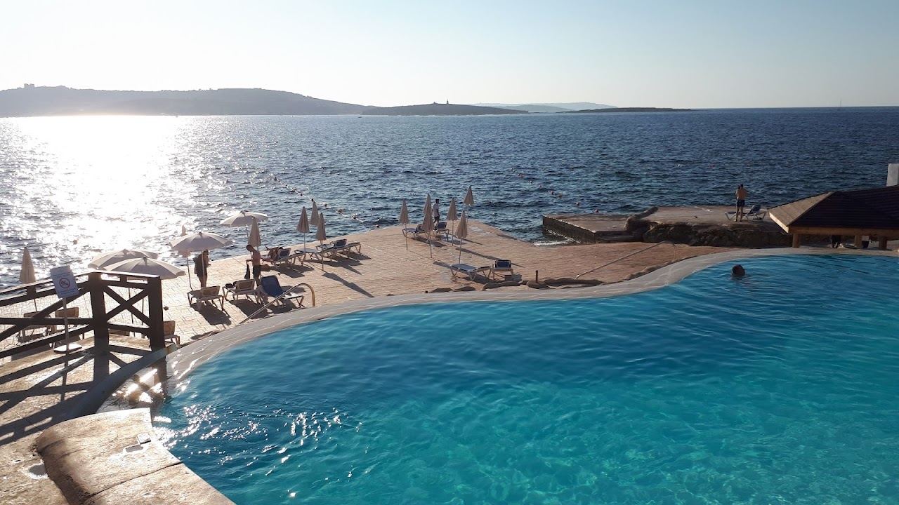 The pool terrace and sea facing deck of Amazonia Beach Club above the Qawra water at the Dolmen resort in Malta