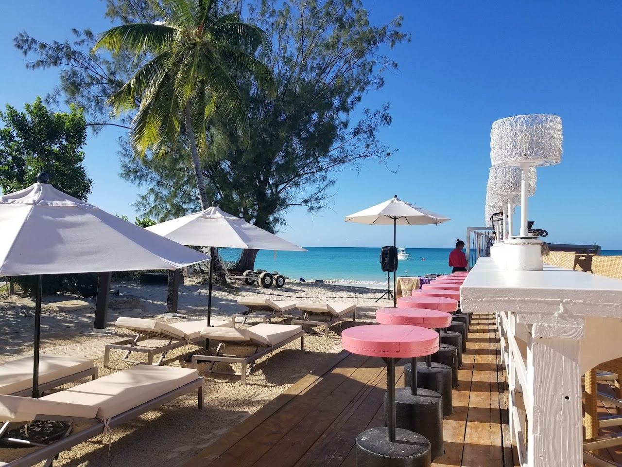 Beachfront tables and loungers at Ana's on the Beach restaurant on Dickenson Bay in Antigua