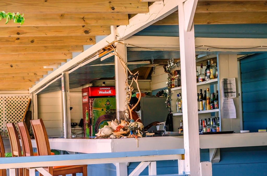 Breezy terrace and sea view at Dennis Cocktail Bar on the hill above Ffryes Beach in Antigua