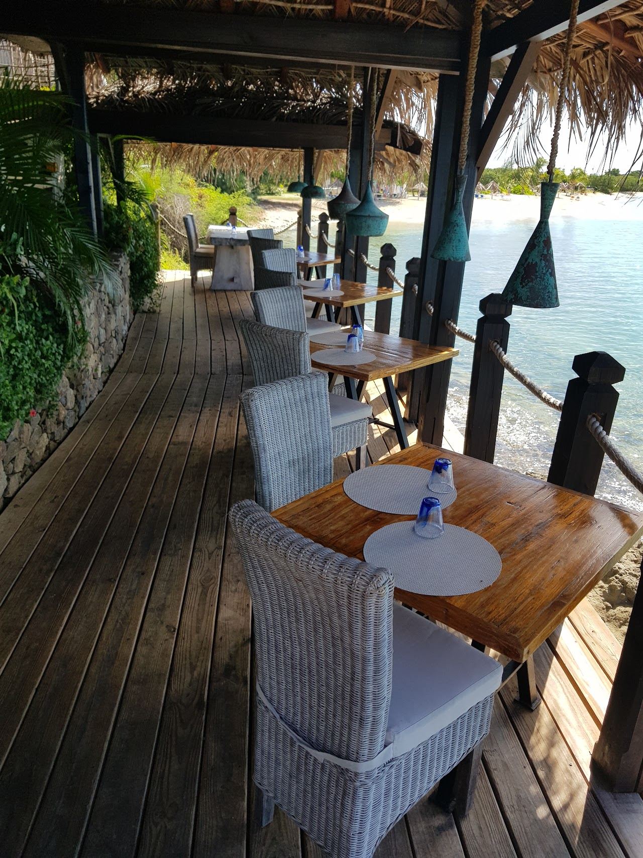 Clifftop terrace and infinity pool overlooking the sea at Sheer Rocks above Ffryes Beach in Antigua