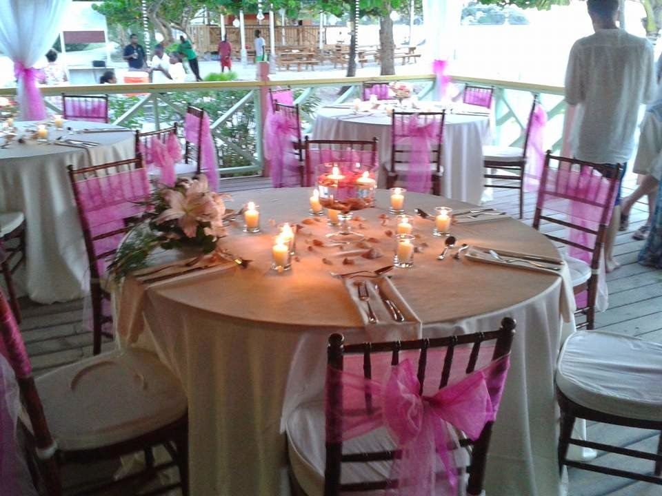 The pink wooden shack of The Nest Beach Bar and Restaurant on the white sand at Valley Church Beach in Antigua