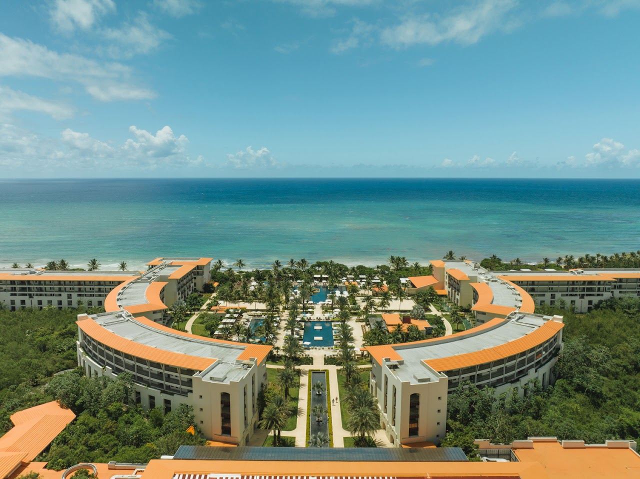 The pool and beach at UNICO 20 87 adults only resort in the Riviera Maya