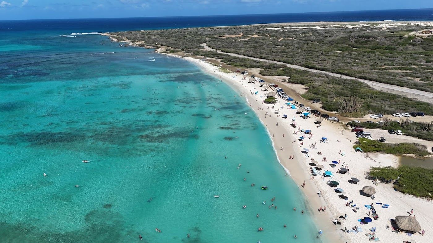 Clear calm water and pale sand at Arashi Beach near the California Lighthouse in northwest Aruba