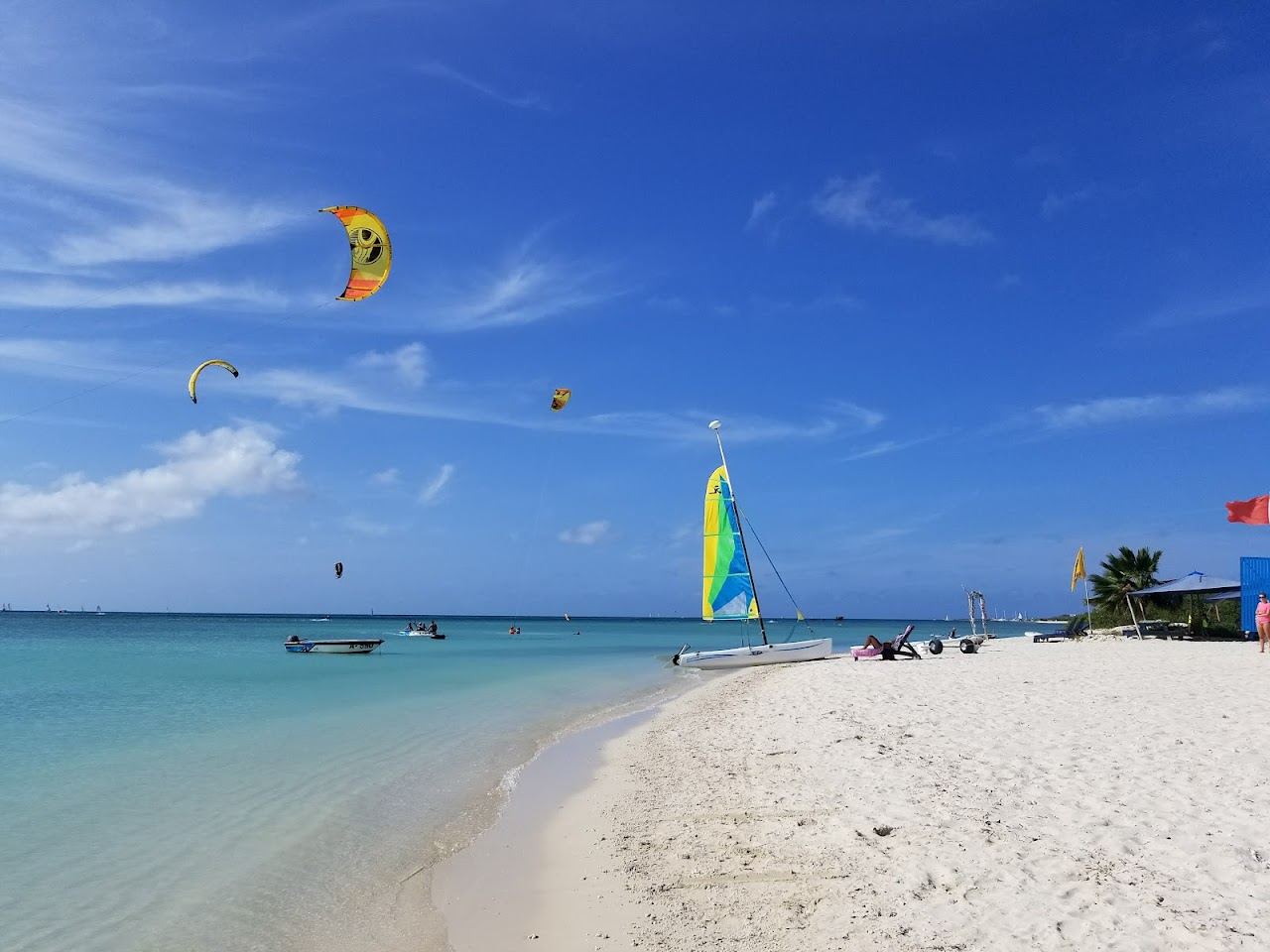 Windsurfers and kitesurfers on the bright flat water off the northwest coast of Aruba