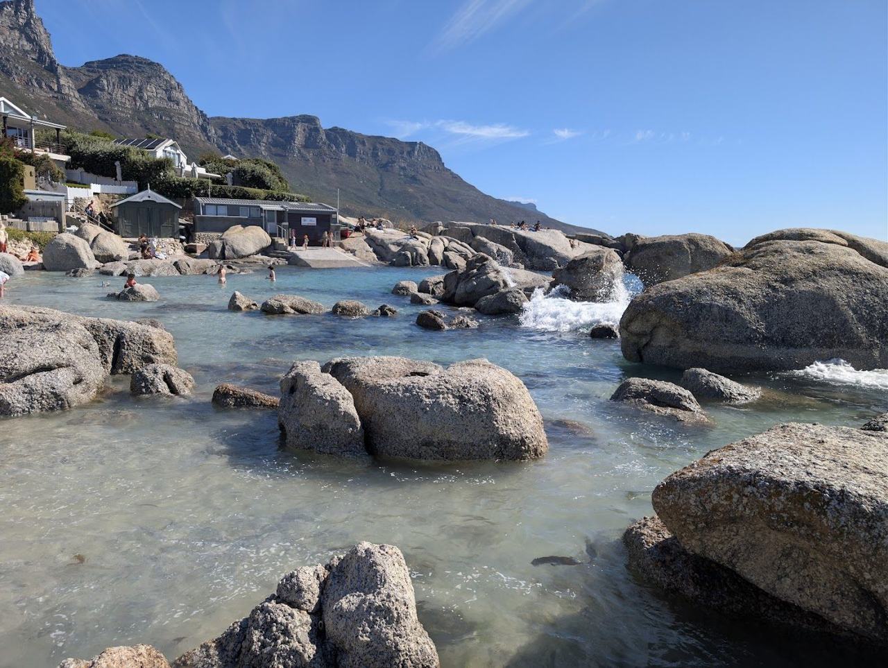 Bakoven granite boulders and a small sandy cove south of Camps Bay in Cape Town
