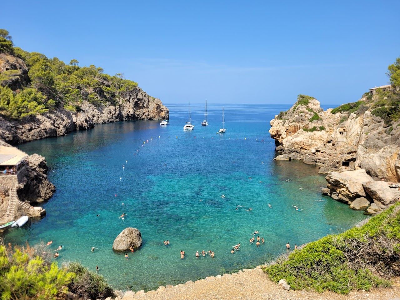 The pebbly cove of Cala Deia below the Tramuntana mountains on Mallorca