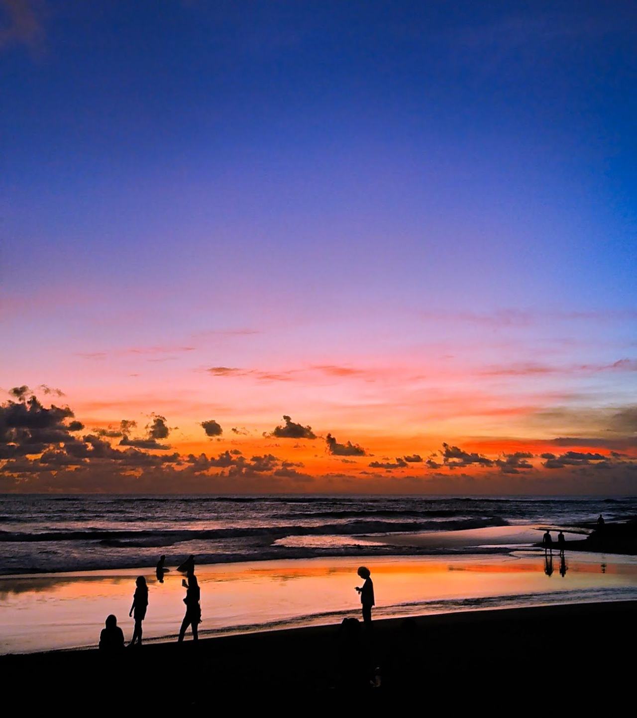 Black sand and surf at Berawa Beach in Canggu Bali