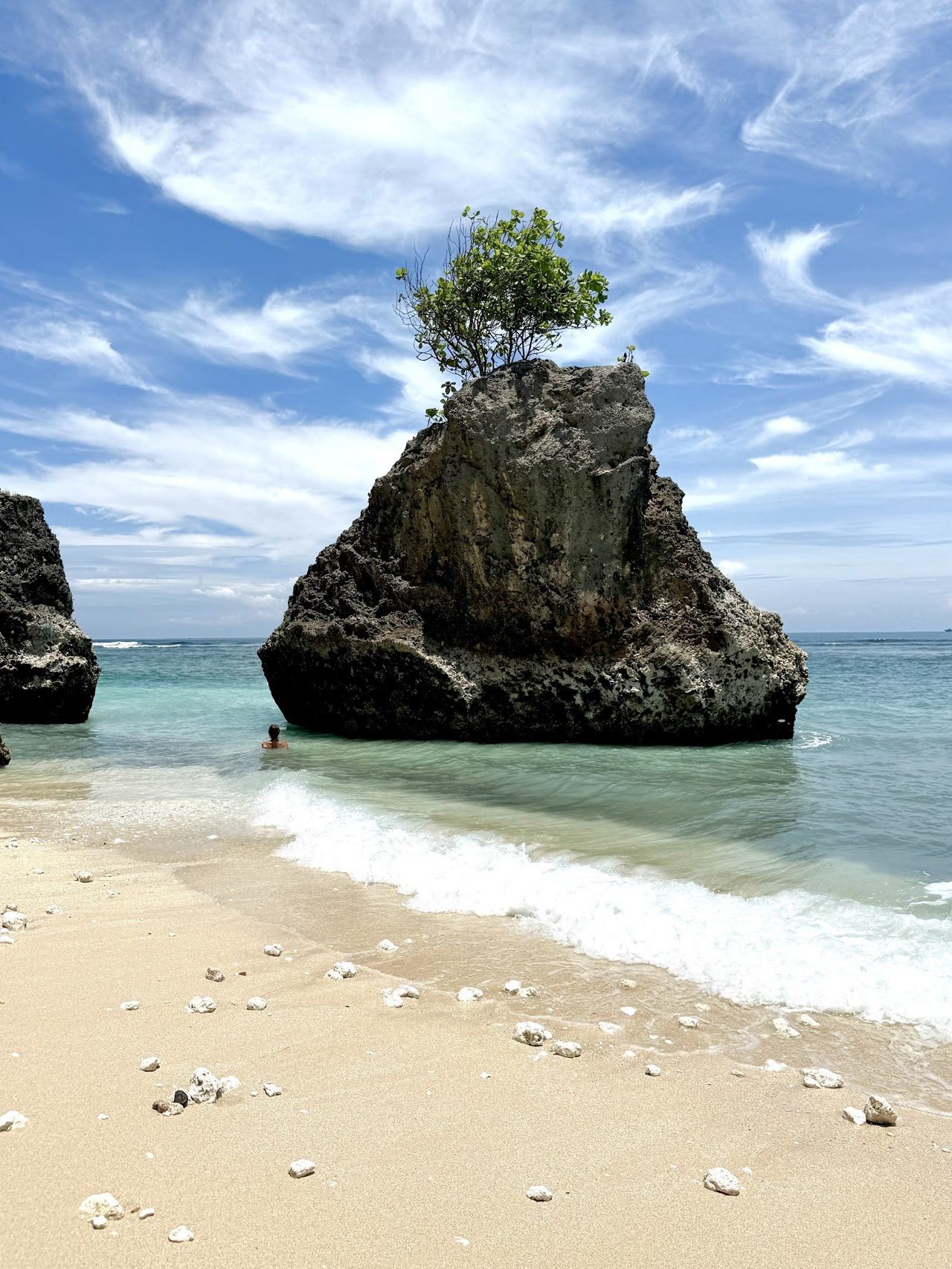 Limestone cliffs above the quiet cove at Bingin beach near Uluwatu in Bali