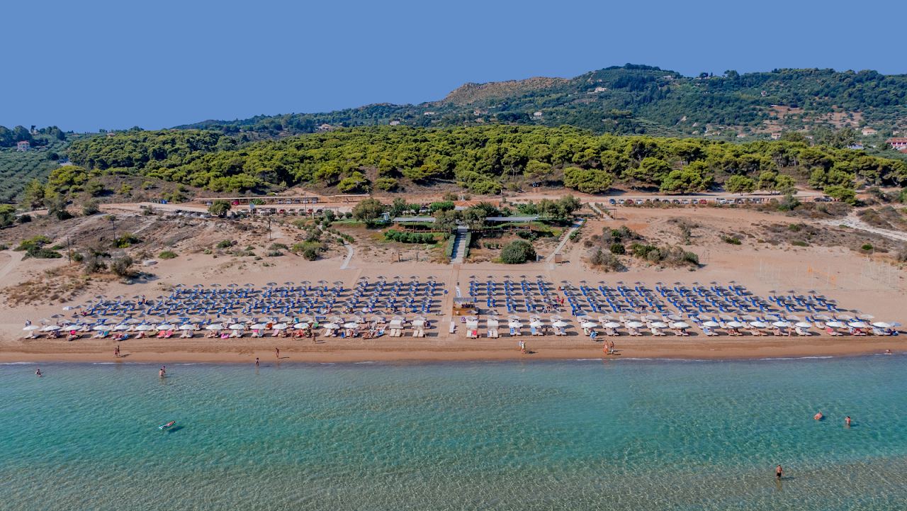 The long golden curve of Banana beach on the Vassilikos peninsula of Zakynthos