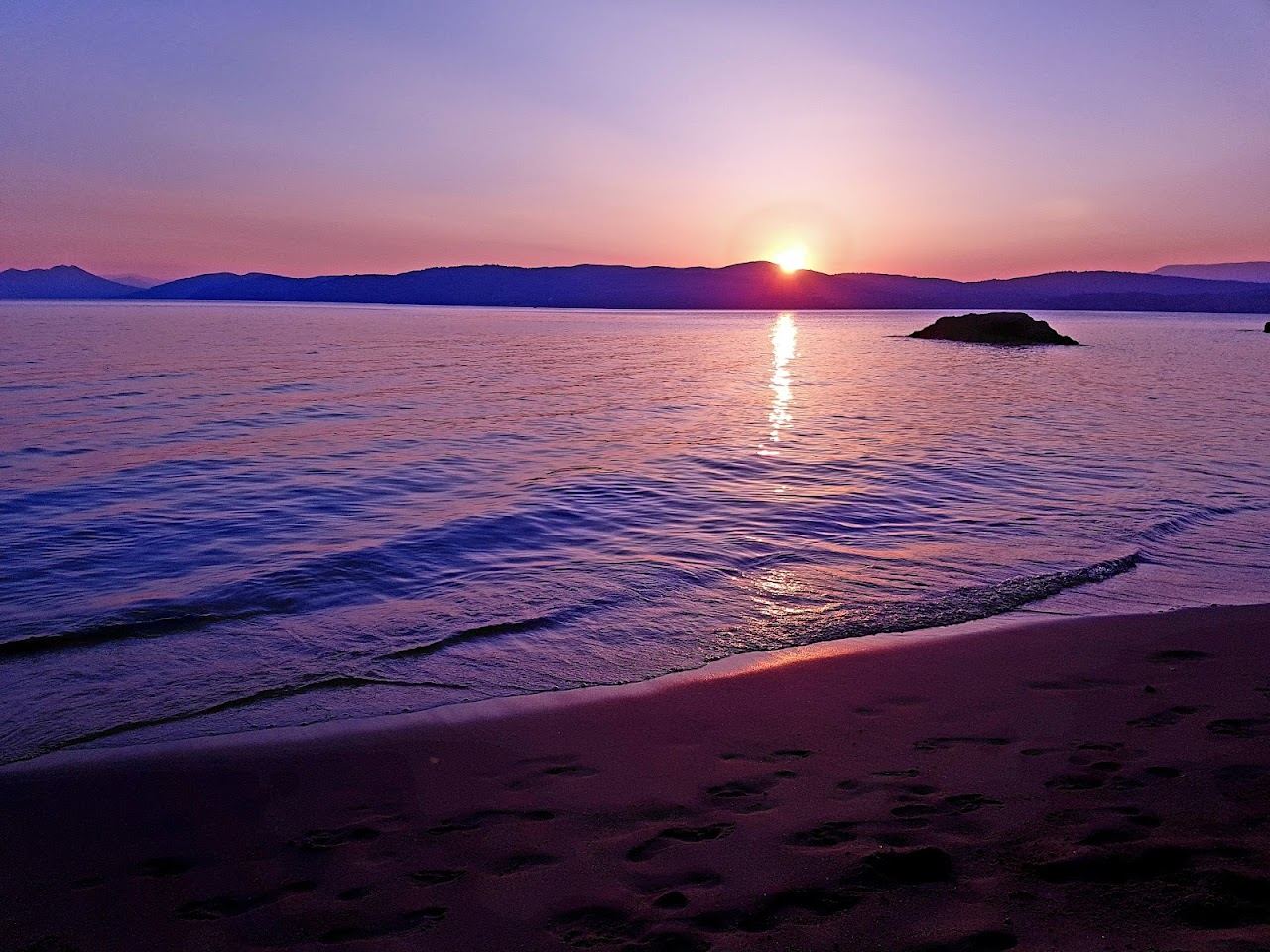 Clear turquoise water and golden sand along Banana Beach on the southwest coast of Skiathos