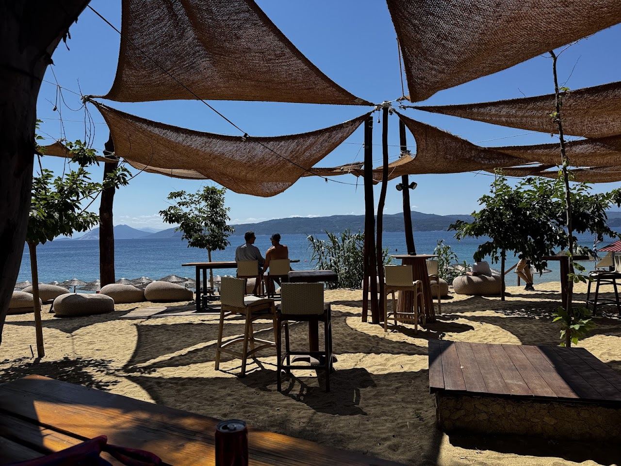 Umbrellas and sunbeds on the sand at Bananarama Beach Bar on Banana Beach, Skiathos