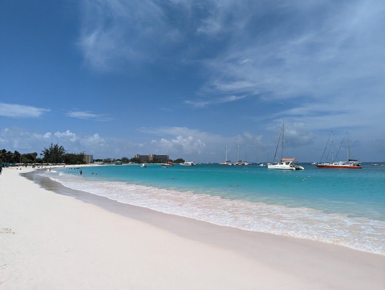 Calm turquoise water and a beach bar on the pale sand of Carlisle Bay near Bridgetown in Barbados