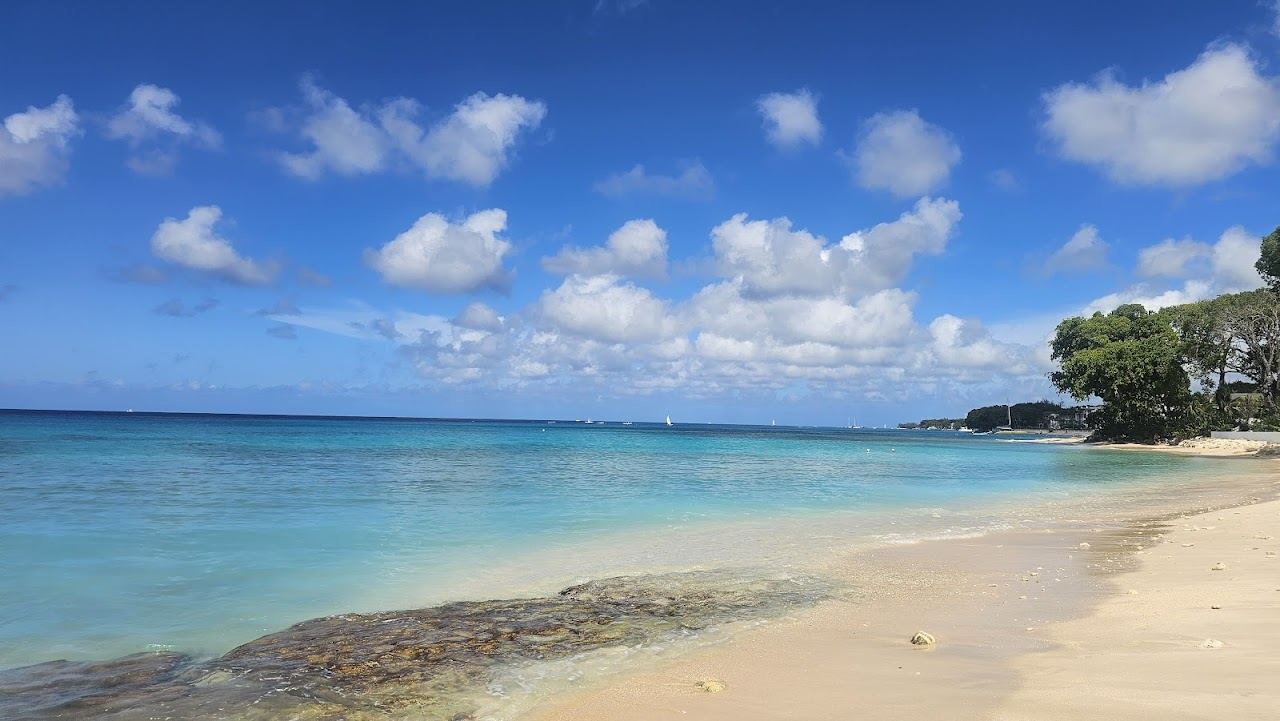 Soft pale sand and calm clear Caribbean water on the sheltered west coast of Barbados