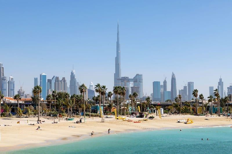 Pastel cabanas and calm Gulf water along the La Mer seafront in Dubai