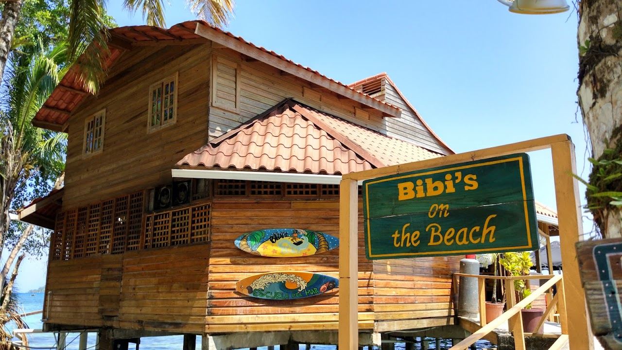 Loungers and a beach bar at a Bocas del Toro beach club