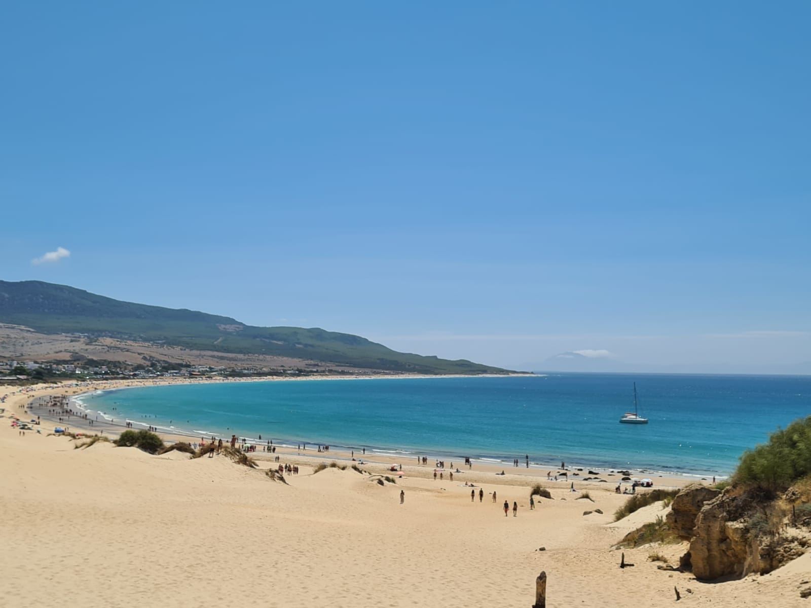Wide golden sand, turquoise Atlantic water and the great natural dune at Bolonia beach near Tarifa on the Costa de la Luz
