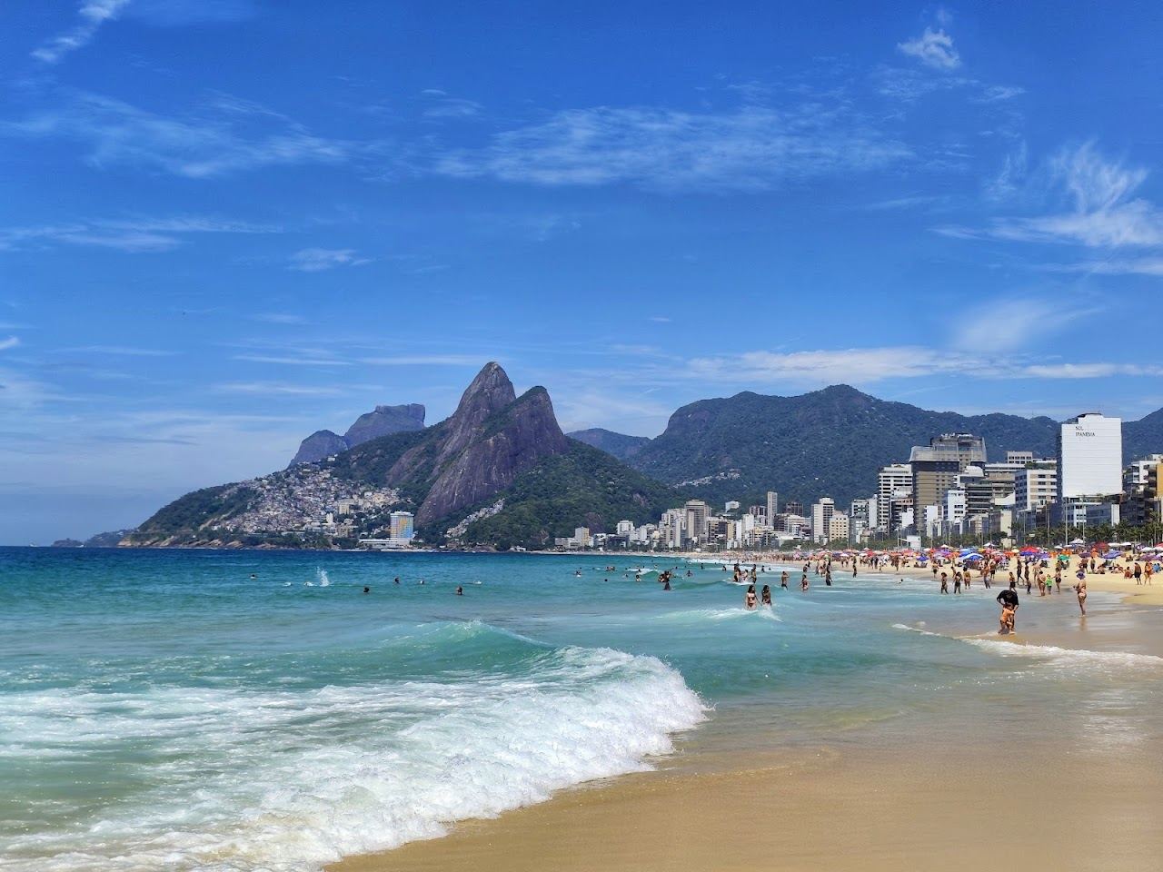 The arc of Ipanema beach below the Dois Irmaos hills in Rio
