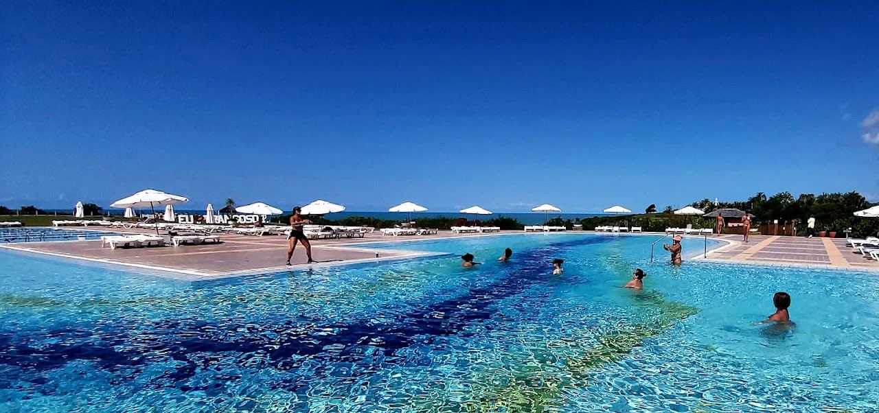 Calm tidal pools and low bluffs at Praia do Espelho in Bahia