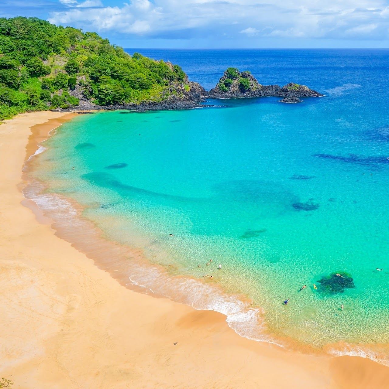Clear water and green headlands above a protected bay at Fernando de Noronha in Brazil
