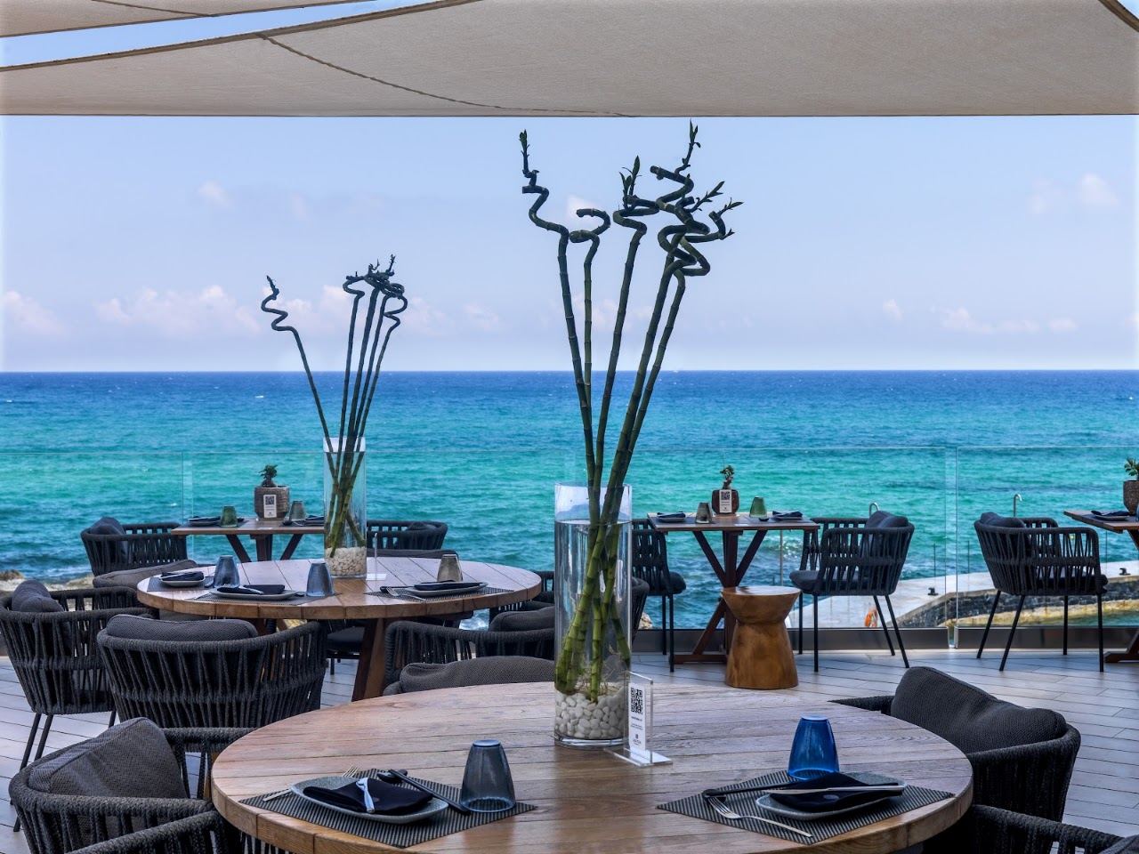 Loungers and cabanas by the sea at Buddha Bar Beach at the Abaton resort near Hersonissos, Crete