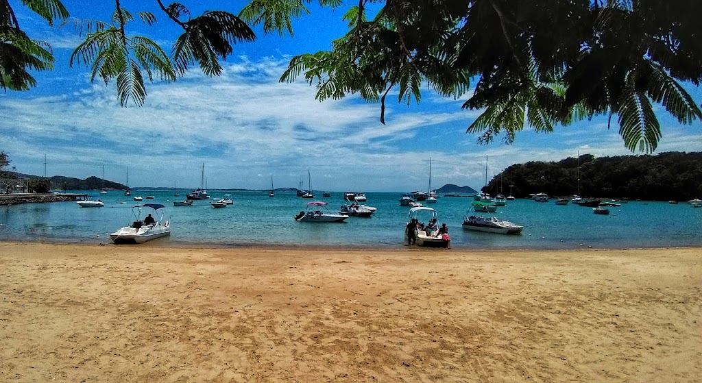 Boats and calm water at Praia dos Ossos, the walk in point for Praia Azeda in Buzios