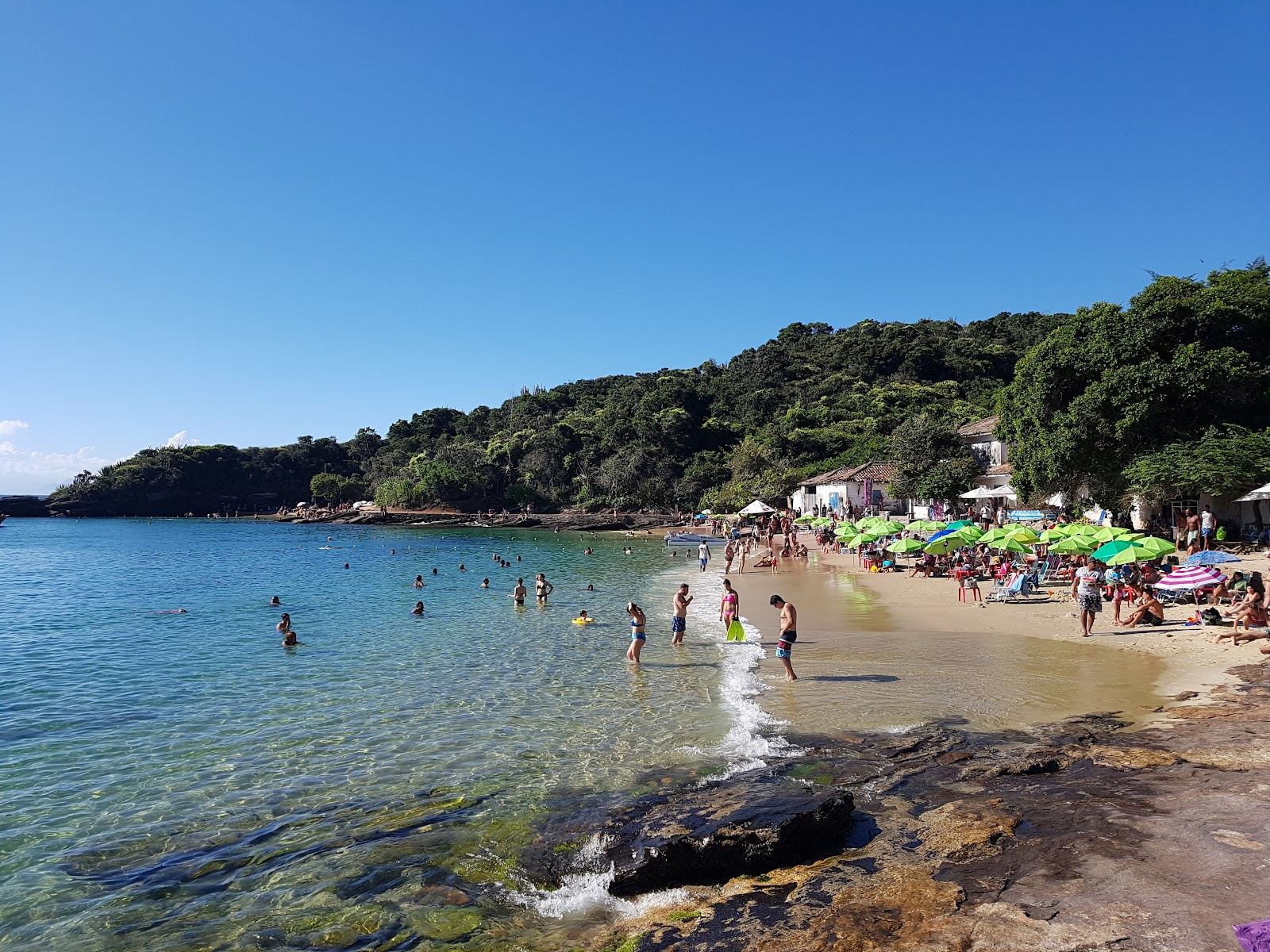 Clear flat water and pale sand in the sheltered Azeda cove at Buzios in Brazil