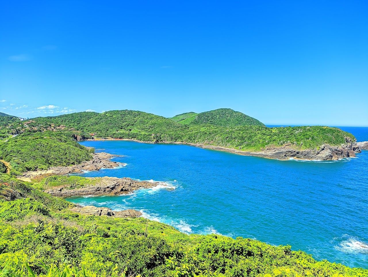 Sheltered cove and clear green water at Praia do Forno in Buzios