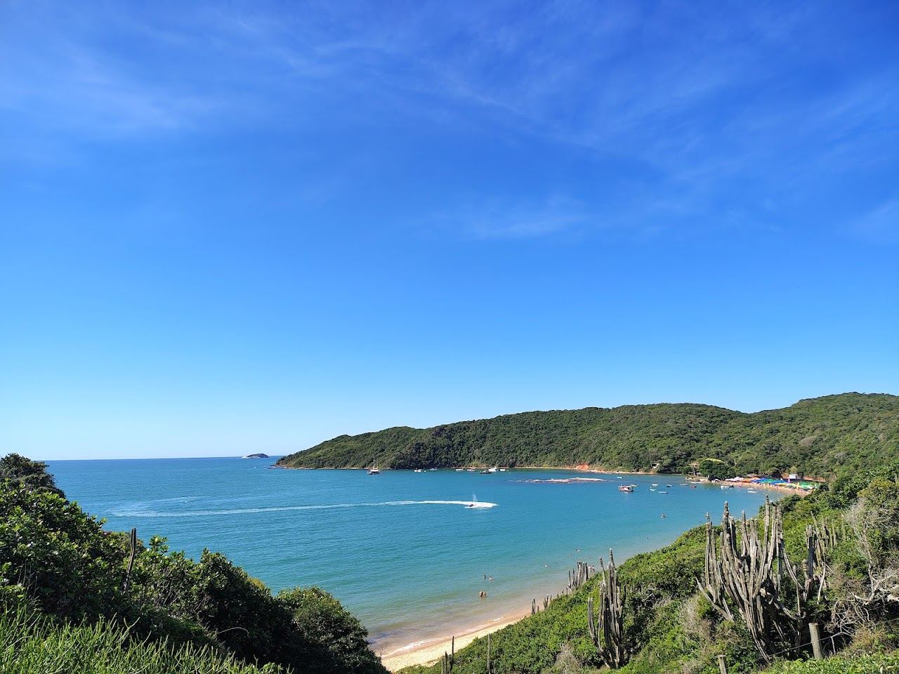Sheltered clear water and soft sand backed by rock at Praia da Tartaruga in Buzios