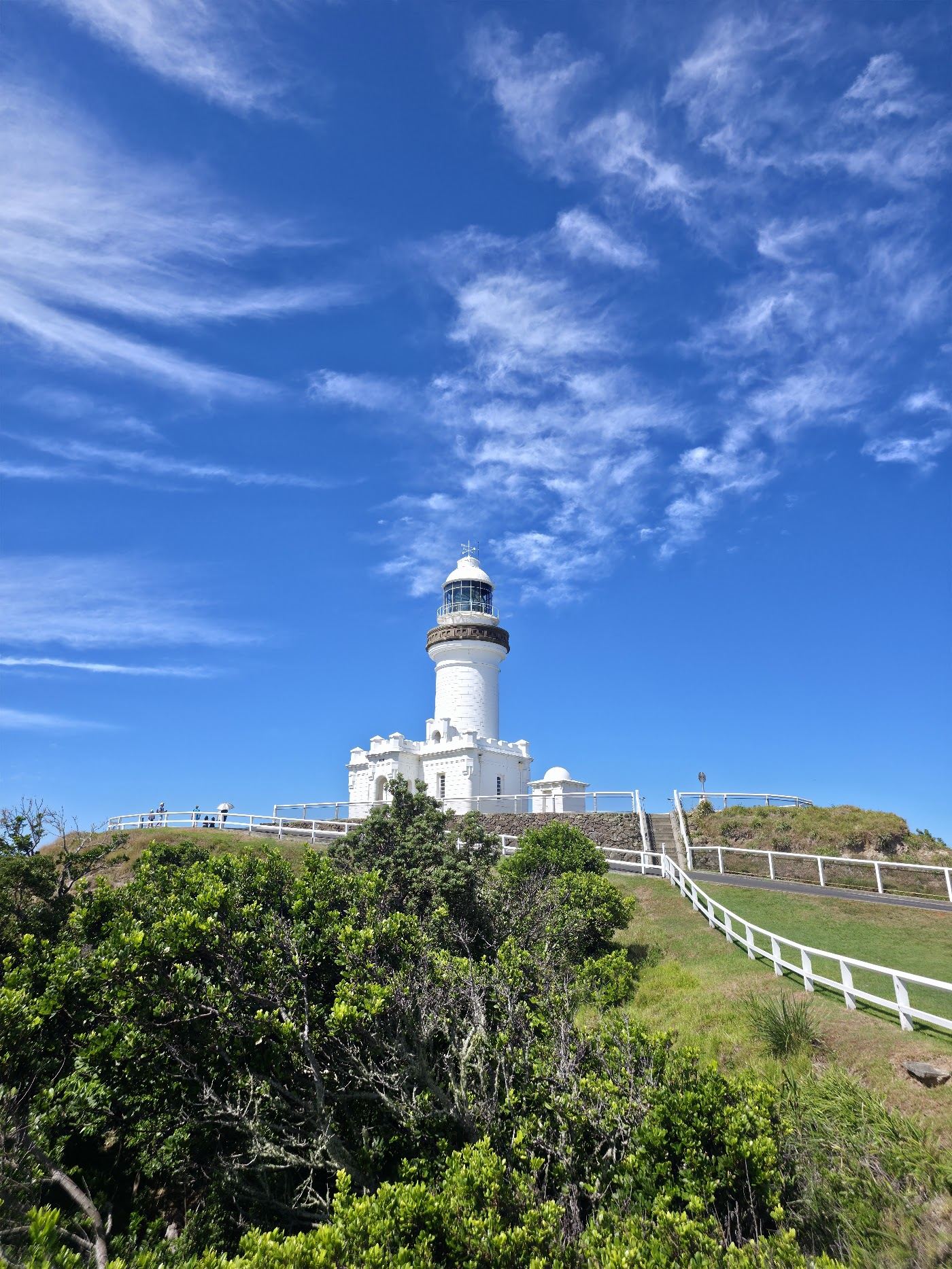 The Cape Byron lighthouse and headland above the coves at the most easterly point of mainland Australia in Byron Bay, New South Wales