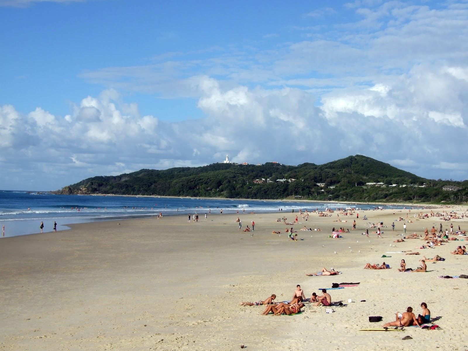 Wide sweep of sand and clear water at Main Beach in the heart of Byron Bay