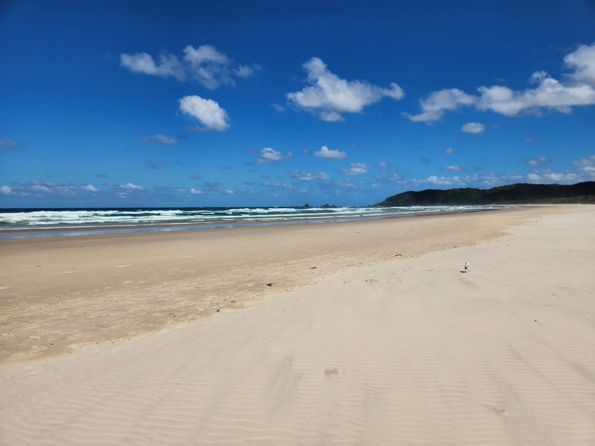 The long open sand of Tallow Beach stretching from Suffolk Park near Byron Bay, New South Wales