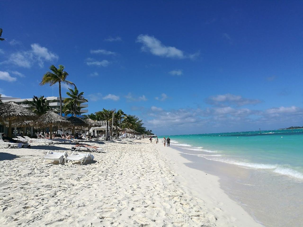 Calm turquoise water and pale sand along Cable Beach west of Nassau in the Bahamas