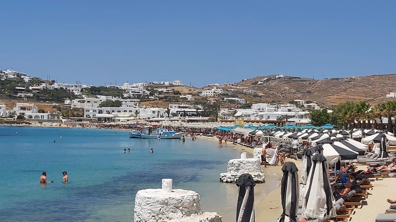 The sheltered south facing bay and calm water of Ornos on Mykonos