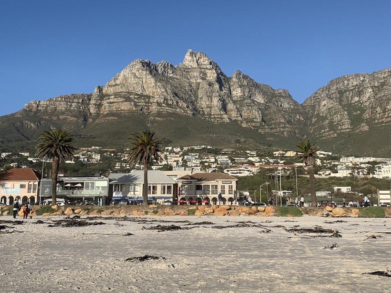 White sand at Camps Bay below the Twelve Apostles ridge in Cape Town