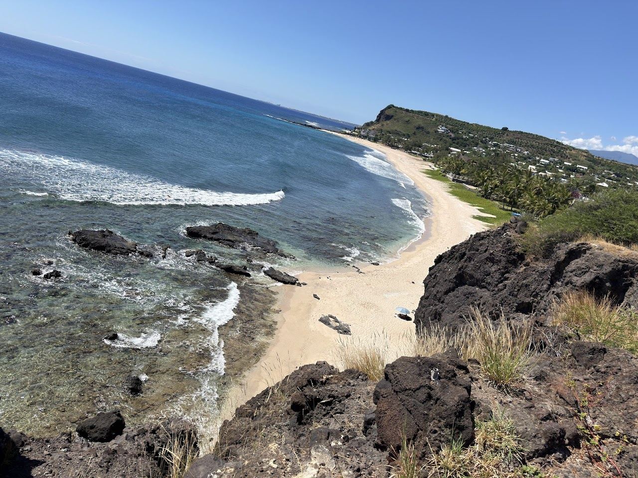 The calm reef lagoon and filao shaded white sand at Cap Homard, La Saline les Bains, Reunion