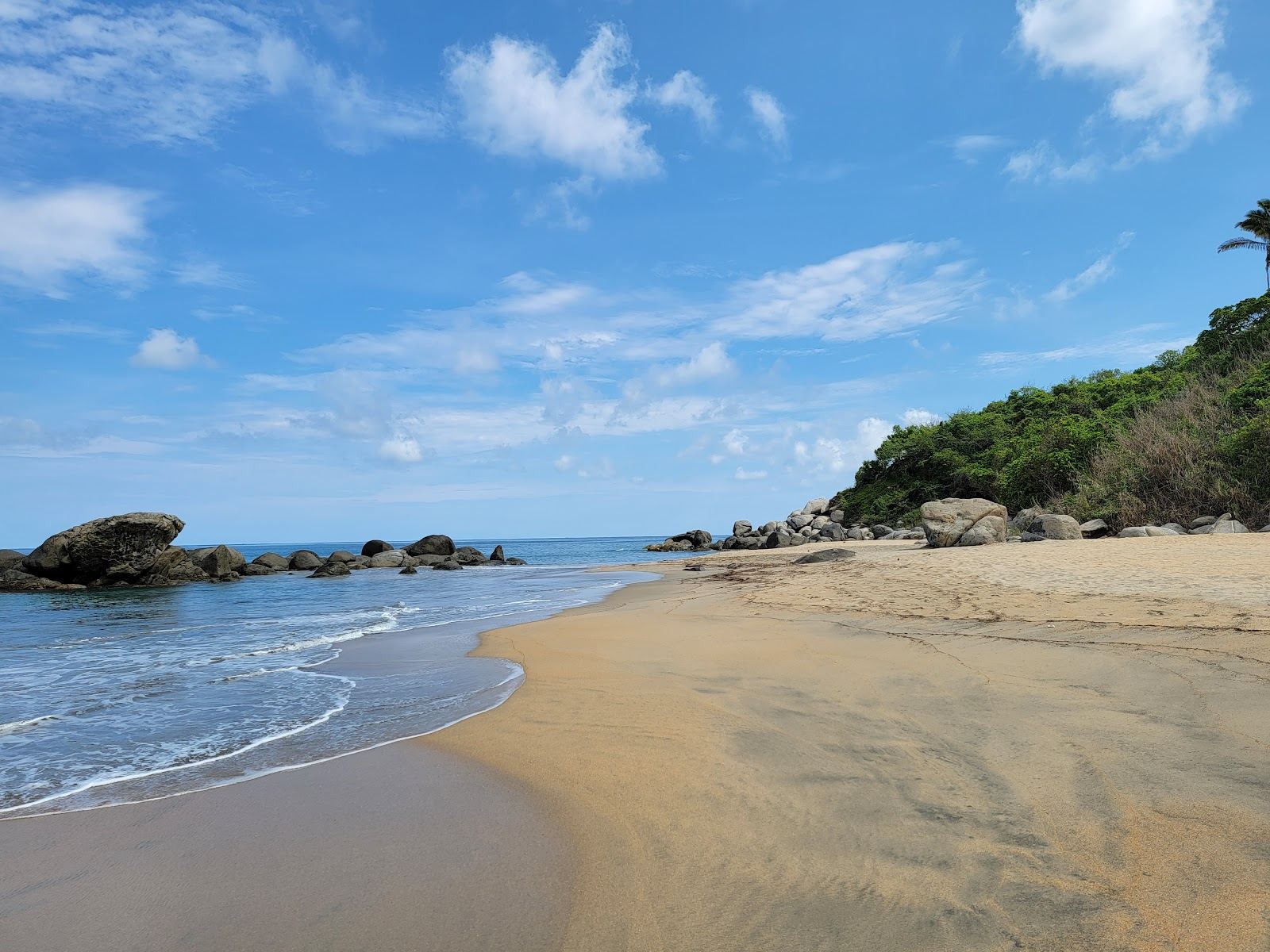 Big waves breaking on the undeveloped sand of Playa Carricitos near Sayulita