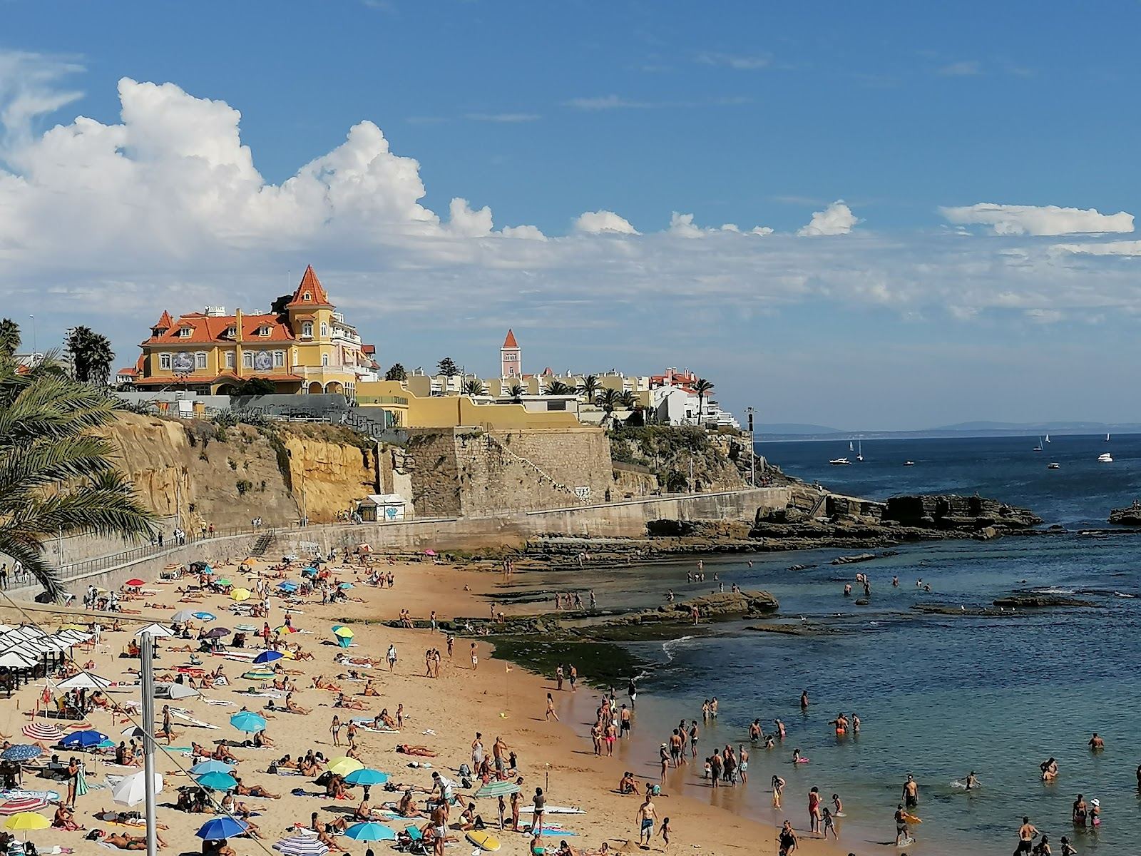 The sheltered golden sand and calm water of Praia da Poca on the Estoril coast near Cascais