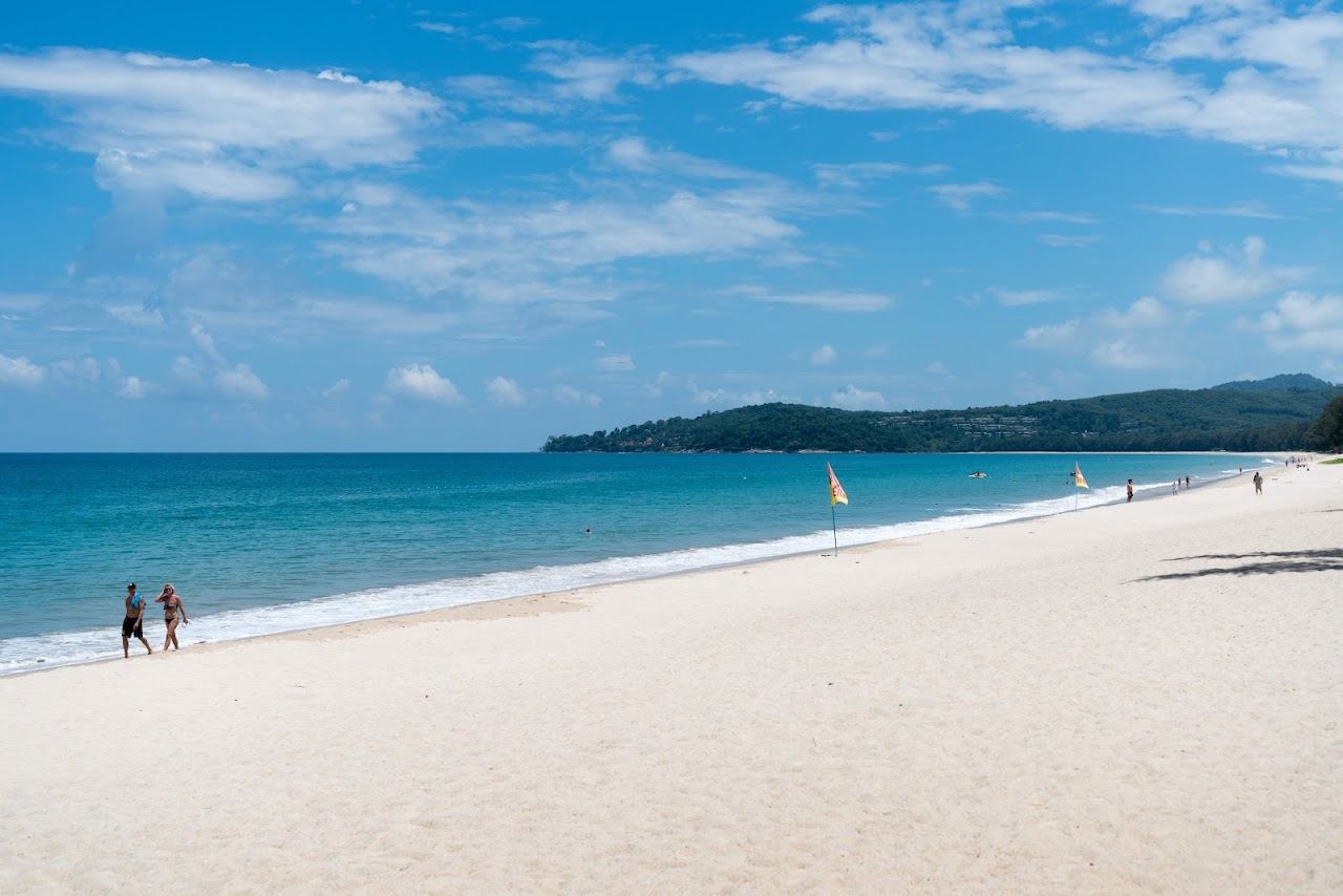 Long soft sand and calm water along Bang Tao beach on the northwest coast of Phuket