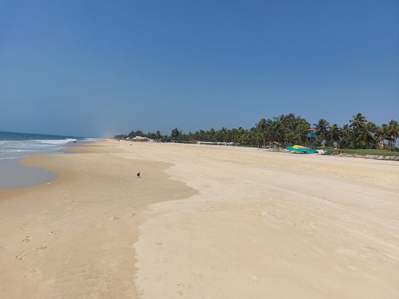 Cavelossim Beach white sand on the Mobor peninsula between river and sea in South Goa