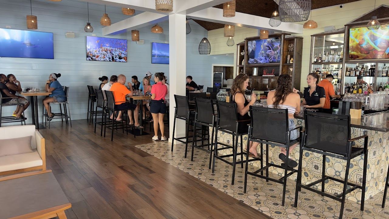 The sandy bay and beach bar setting at Rum Point on the north side of Grand Cayman