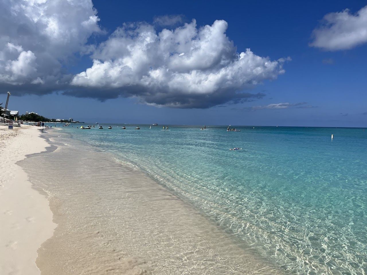 Powdery white sand and calm clear turquoise water along Seven Mile Beach on Grand Cayman